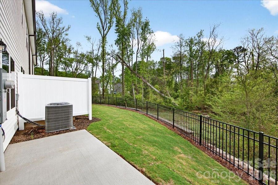 Extended outdoor living with wooded views Extended outdoor living with wooded views