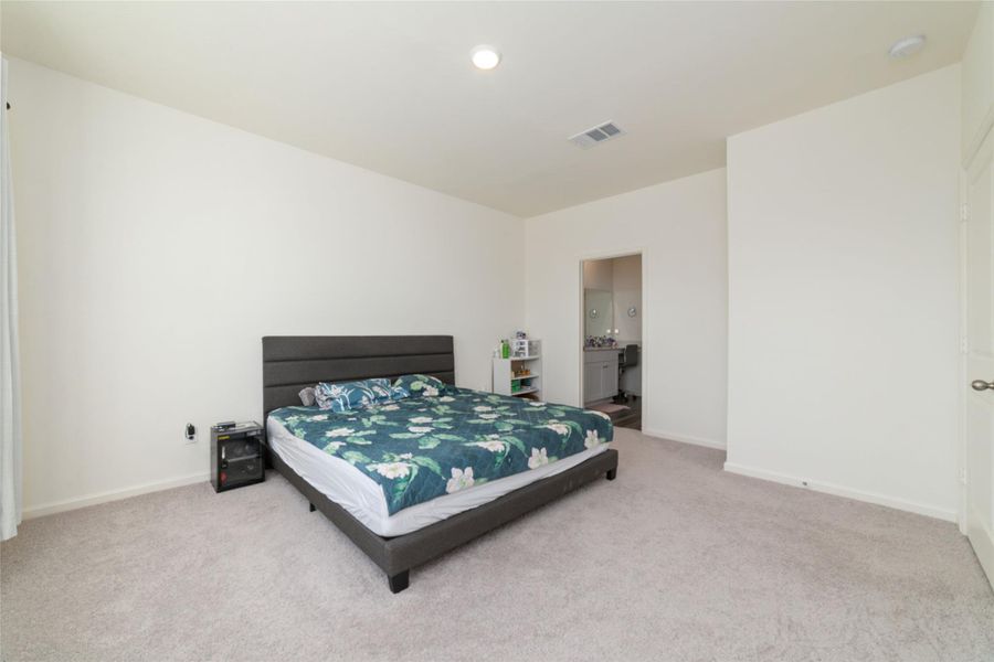 Furnished interior view inside a new home in Sunterra, Katy (Image 17).