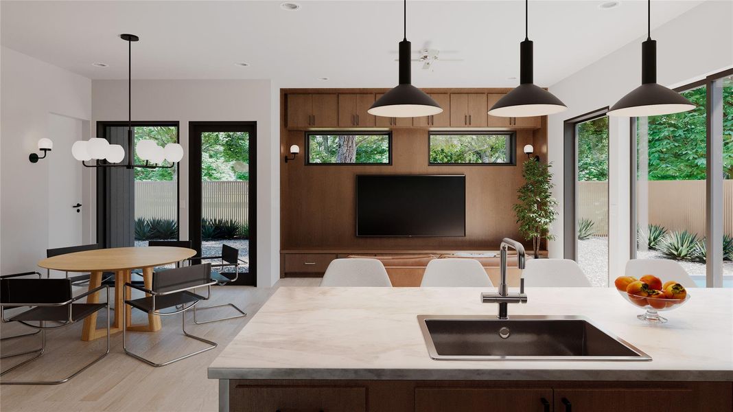 Kitchen with hanging light fixtures, recessed lighting, light wood finished floors, and a chandelier Kitchen with hanging light fixtures, recessed lighting, light wood finished floors, and a chandelier