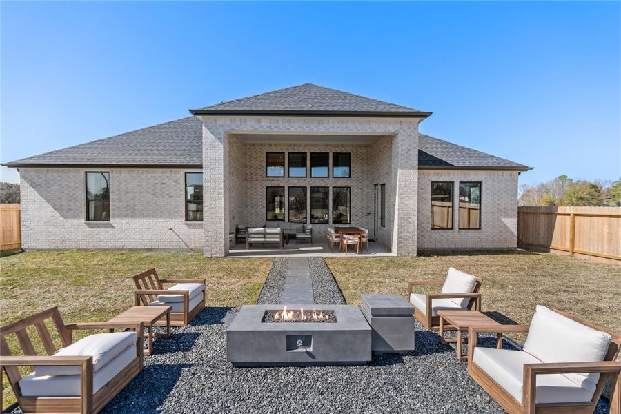 Shown in the photo is the outdoor firepit with seating around Shown in the photo is the outdoor firepit with seating around