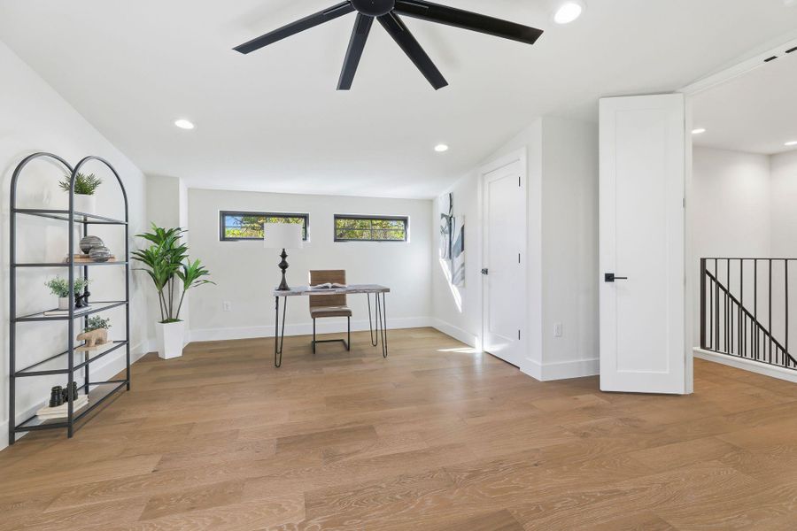 Unfurnished office featuring light wood-type flooring, recessed lighting, and ceiling fan