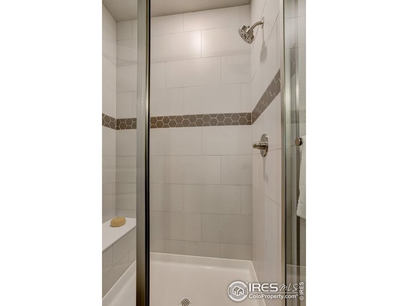 Primary Shower-  Photos not of the actual unit. Finishes vary.