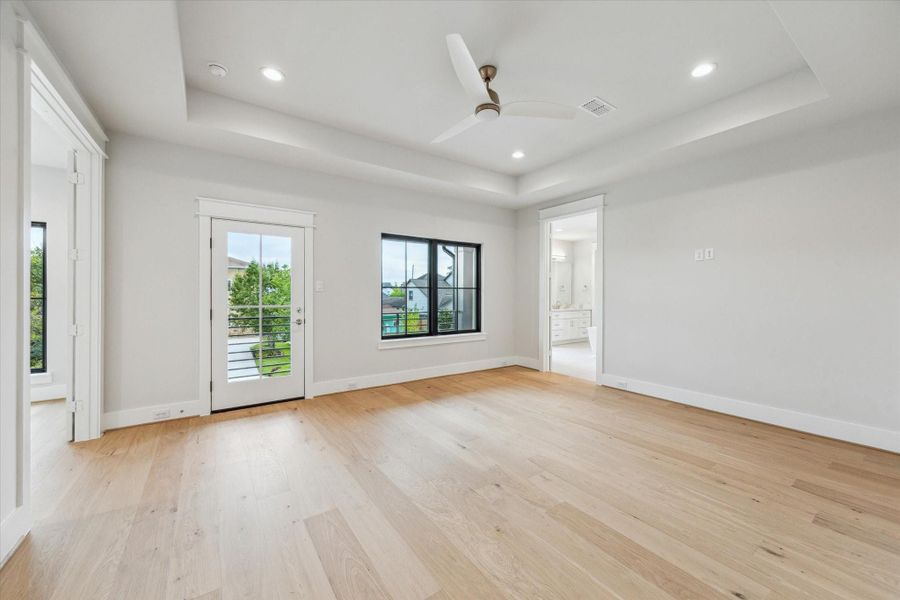 Upstairs, the primary suite has a balcony and a separate flexible living space. Upstairs, the primary suite has a balcony and a separate flexible living space.