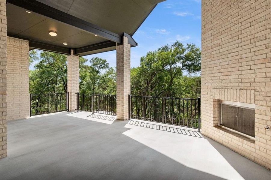 Covered patio with outdoor fireplace