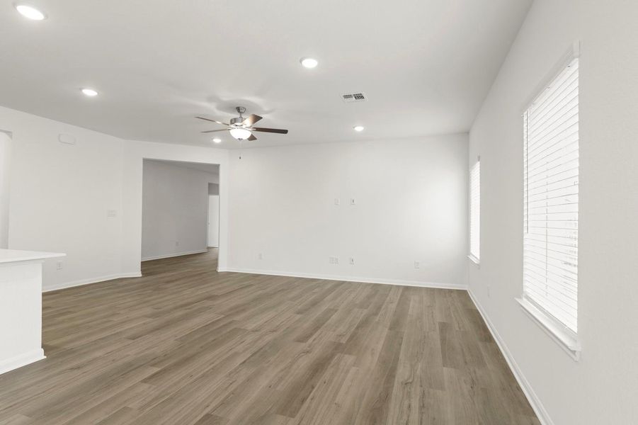 Spare room featuring wood finished floors, recessed lighting, and ceiling fan