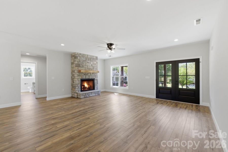 Statement floor-to-ceiling stone fireplace