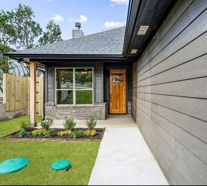 Property entrance with a lawn