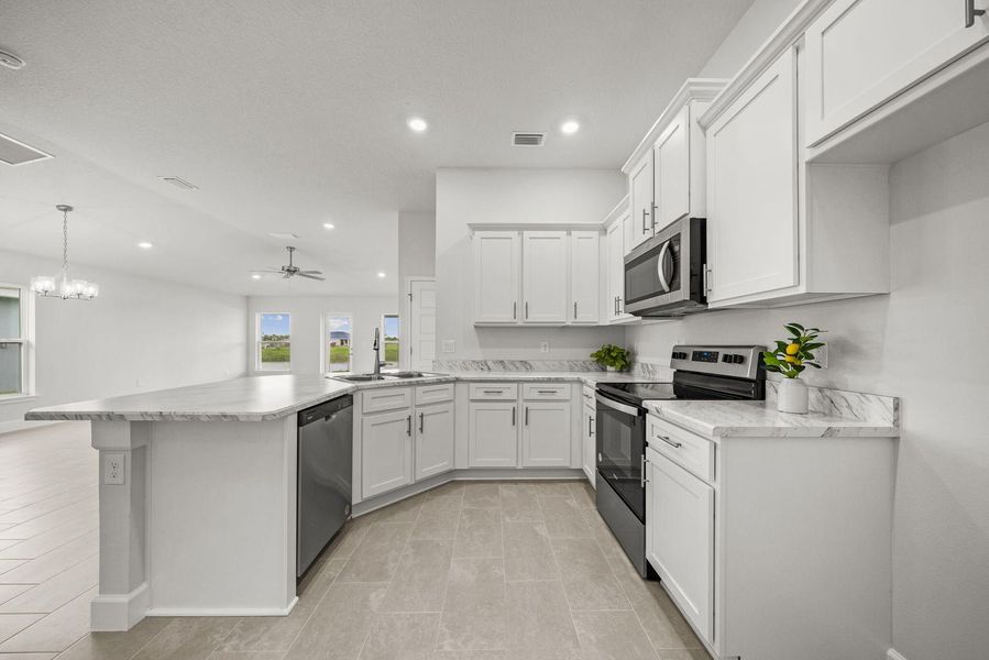 Representative furnished interior of a home built from the 1635 by Adams Homes in Winding Oaks, Weeki Wachee (Image 9).