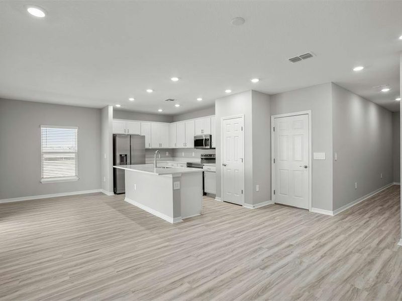 Enjoy a sunny, open living area, with LVP flooring throughout the first floor.