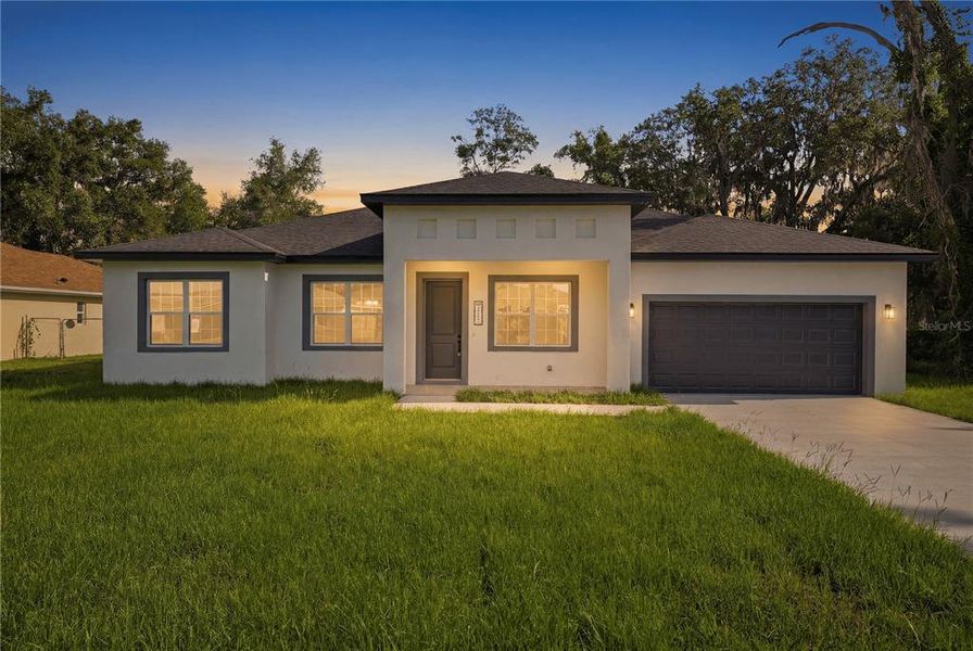 Front exterior of a new home in , Ocala, FL, highlighting curb appeal (Image 22).