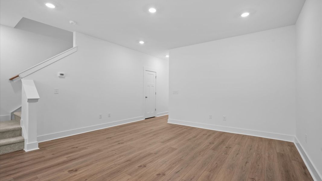 Hardwood flooring and high standards define this vibrant family room ideal for everyday living located in Simpsonville, SC