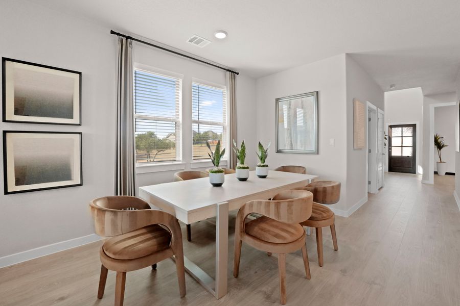 Dining Room in the Lakeside at Tessera Willow model home in Lago Vista TX by Trophy Signature Homes