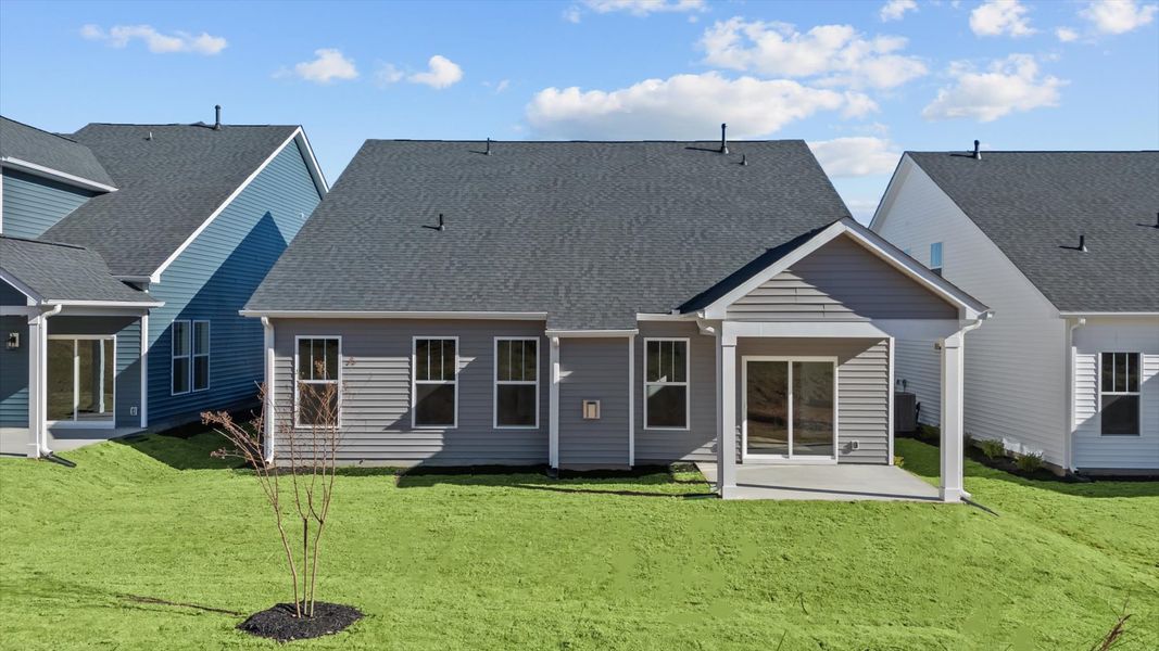 Refined rear exterior with a stylish covered porch for dining, relaxing, or entertaining