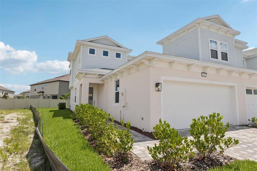 Front exterior of a new home in Lagoon Residences at Epperson, Wesley Chapel, FL, highlighting curb appeal (Image 23).