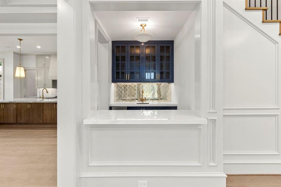 Facing the formal dining, the wet bar has its own icemaker. Perfect for entertaining