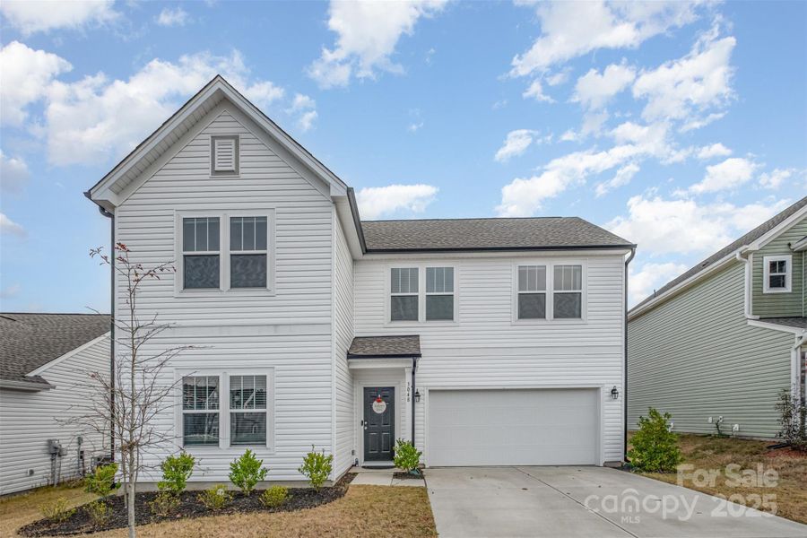 Front exterior of a new home in , Mount Holly, NC, highlighting curb appeal (Image 1).