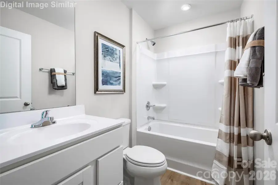 The Shared Guest Bathroom has Bright Finishes and Easy-to-Clean Surfaces. Built to Handle Morning Routines and Splashy Bath Times Alike.