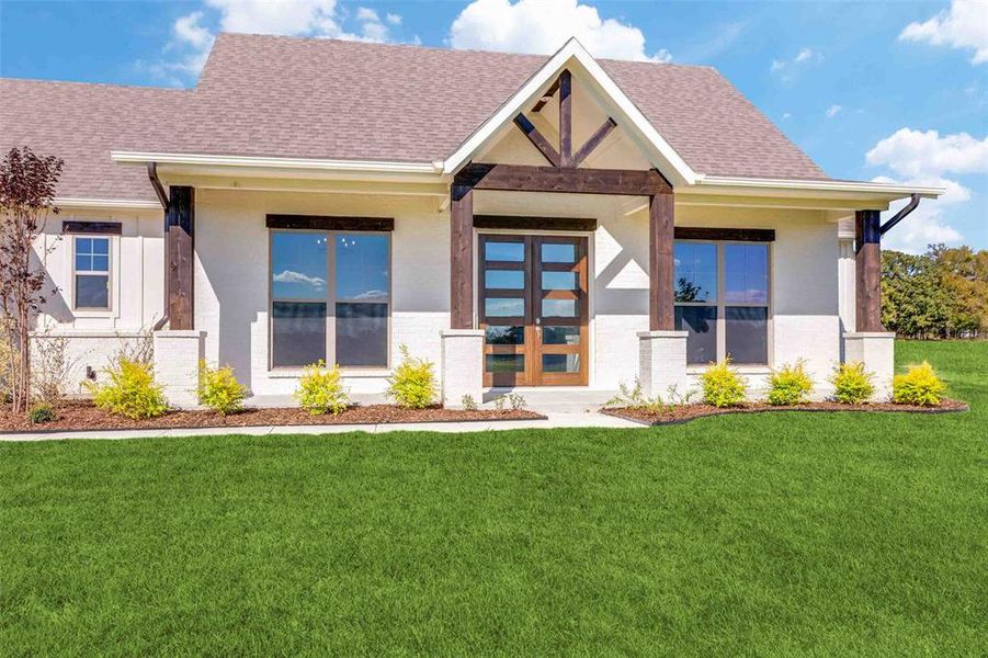 View of front of property featuring a front lawn, a porch, roof with shingles, and stucco siding View of front of property featuring a front lawn, a porch, roof with shingles, and stucco siding