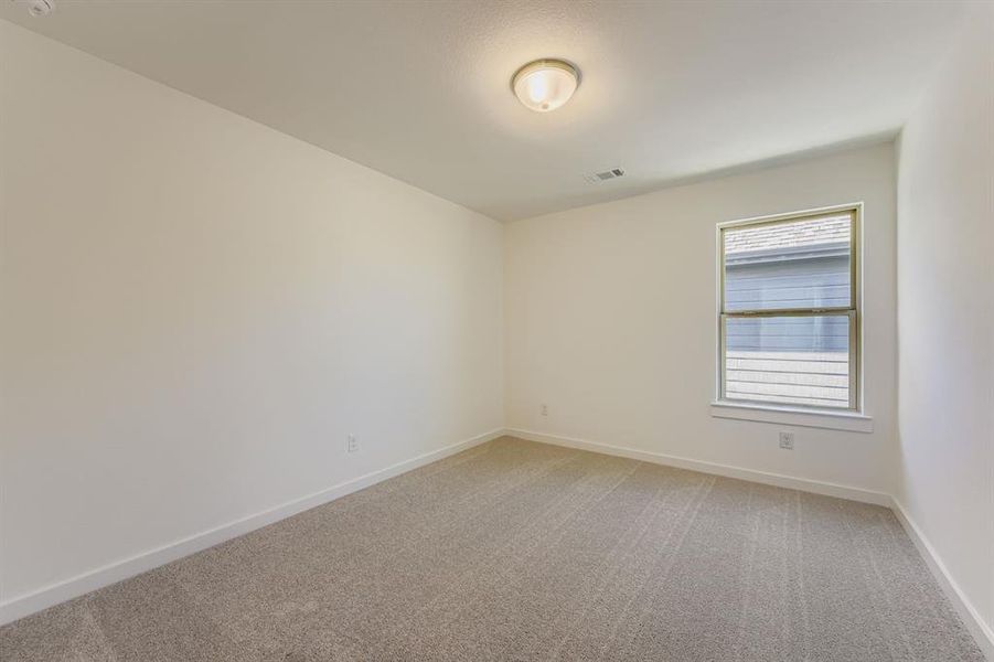 Empty room featuring light colored carpet Empty room featuring light colored carpet