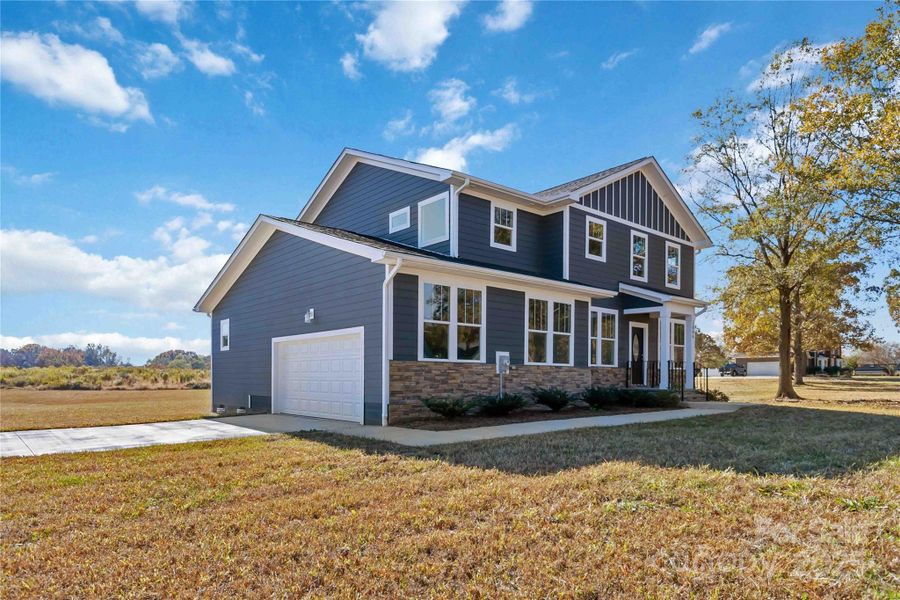 Front exterior of a new home in , Monroe, NC, highlighting curb appeal (Image 2). Front exterior of a new home in , Monroe, NC, highlighting curb appeal (Image 2).