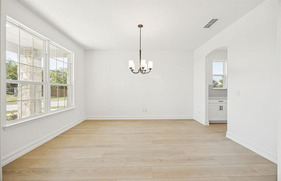 Formal dining room with large windows Formal dining room with large windows