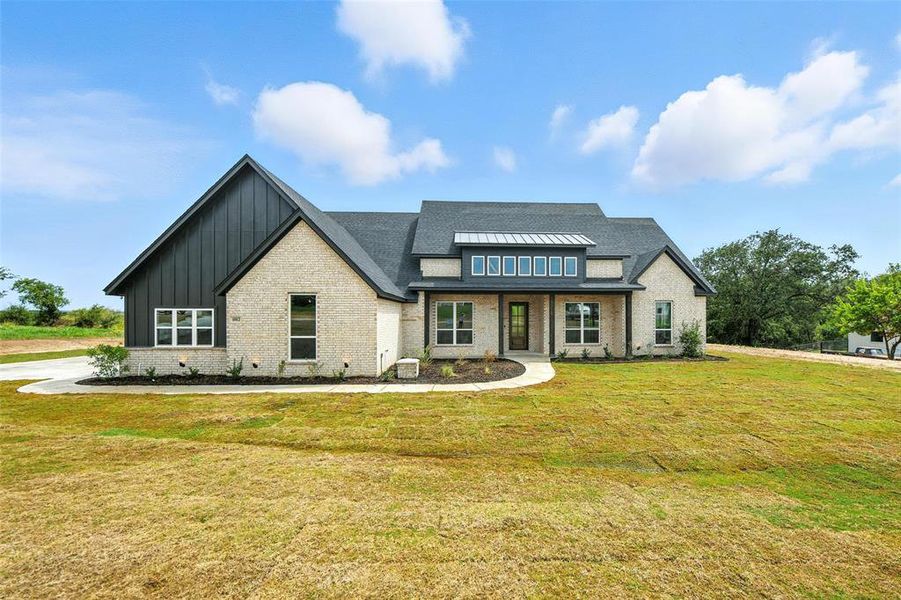 Front exterior of a new home in , Weatherford, TX, highlighting curb appeal (Image 2).
