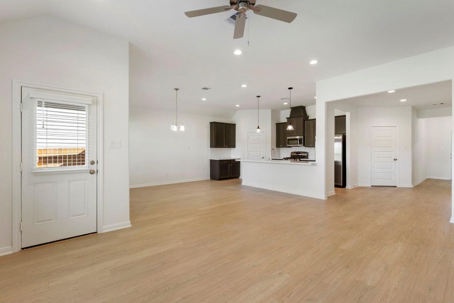 An open, flowing layout from living to dining to kitchen—perfect for everyday living and entertaining.