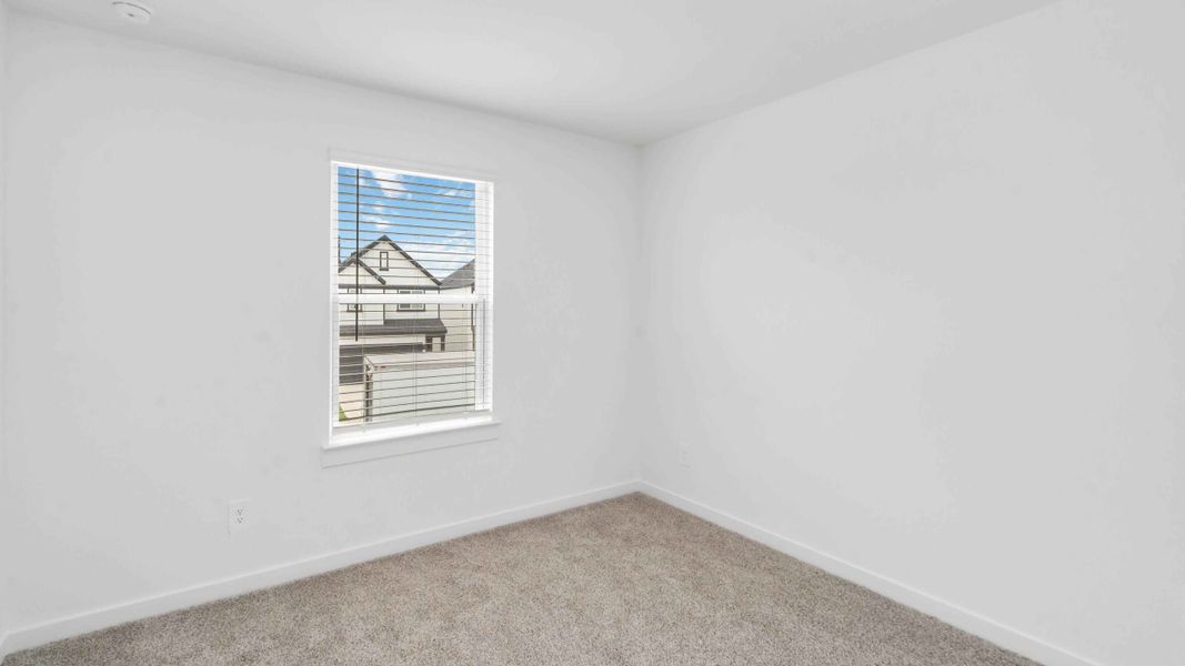 Representative unfurnished interior of a home built from the Jasmine by D.R. Horton in City Gate North, Houston (Image 10).