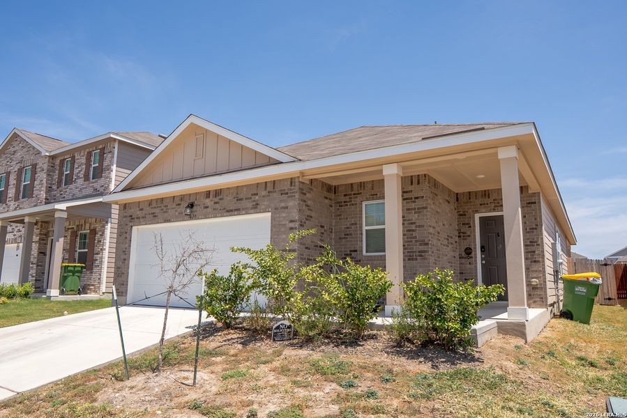 Front exterior of a new home in Trails at Culebra, San Antonio, TX, highlighting curb appeal (Image 21).