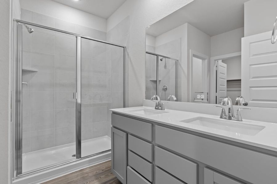 A bathroom with a glass shower.