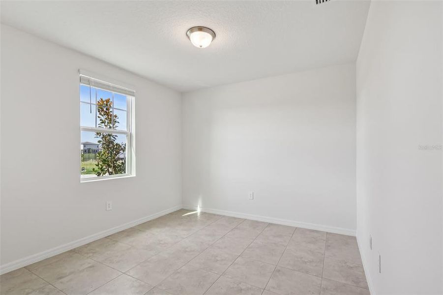 Spacious, unfurnished interior of a new home in Bradbury Creek - Signature Series, Haines City (Image 34).