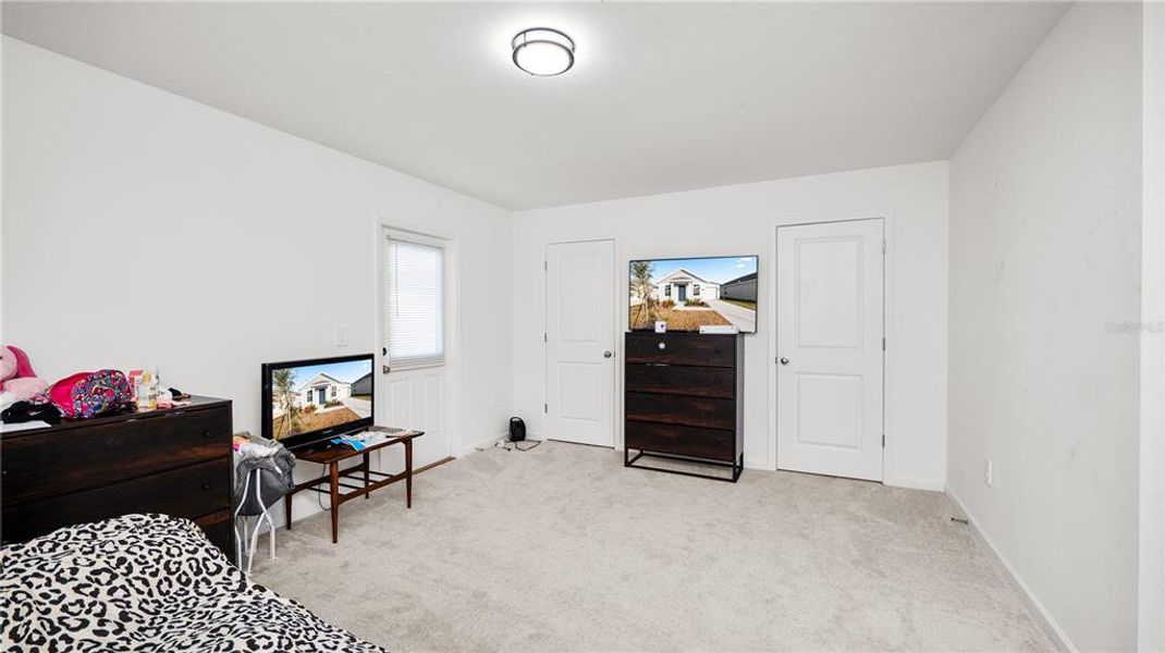 Furnished interior view inside a new home in Peace Creek Reserve: Legacy Collection, Winter Haven (Image 8).