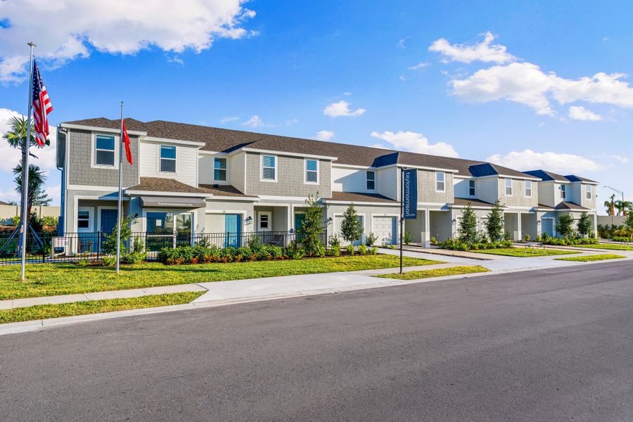 Front exterior of a new home in The Townhomes at Azario Lakewood Ranch, Bradenton, FL, highlighting curb appeal (Image 1). Front exterior of a new home in The Townhomes at Azario Lakewood Ranch, Bradenton, FL, highlighting curb appeal (Image 1).
