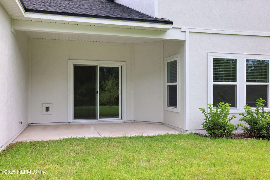 Front exterior of a new home in Cordova Palms, St. Augustine, FL, highlighting curb appeal (Image 16).