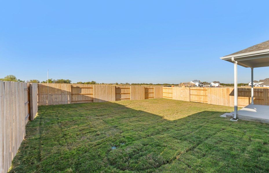 Fenced backyard featuring a patio area
