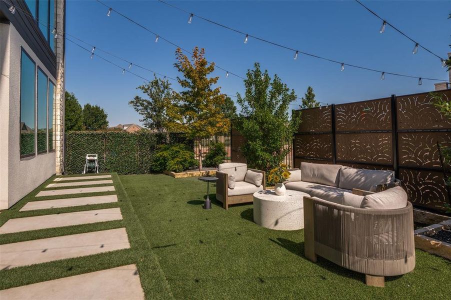 Over-sized corner lot, with pet friendly turf.