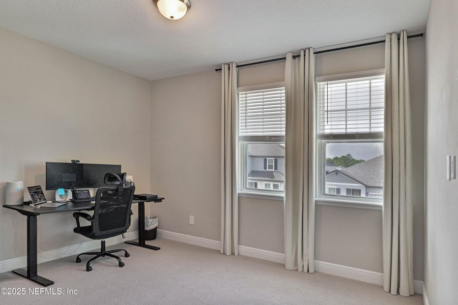 Furnished interior view inside a new home in Legends Preserve - Reserve Series, Daytona Beach (Image 7).