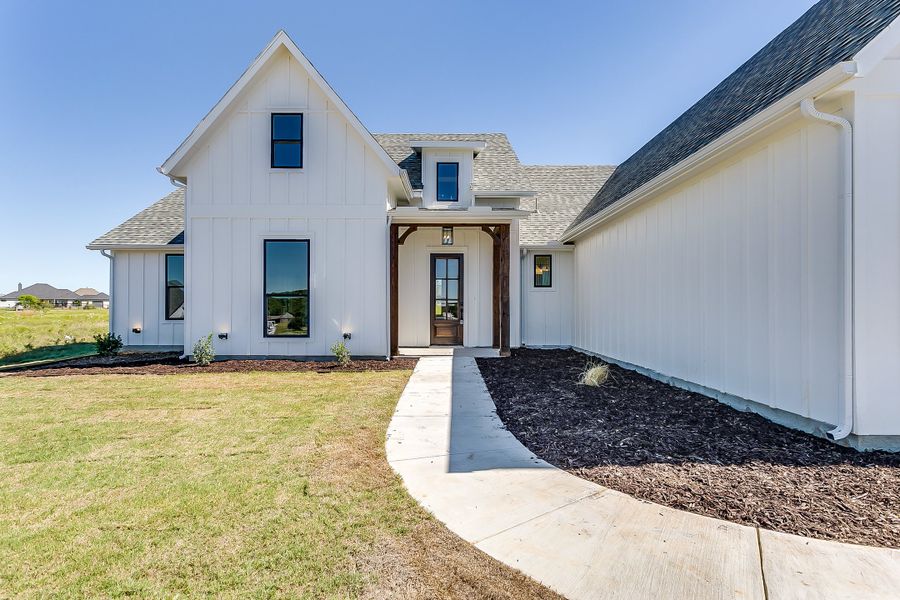 Representative exterior photo of a completed home built from the Augusta Court by Trinity Classic Homes in Freeman Ranch, Weatherford, TX (Image 28).