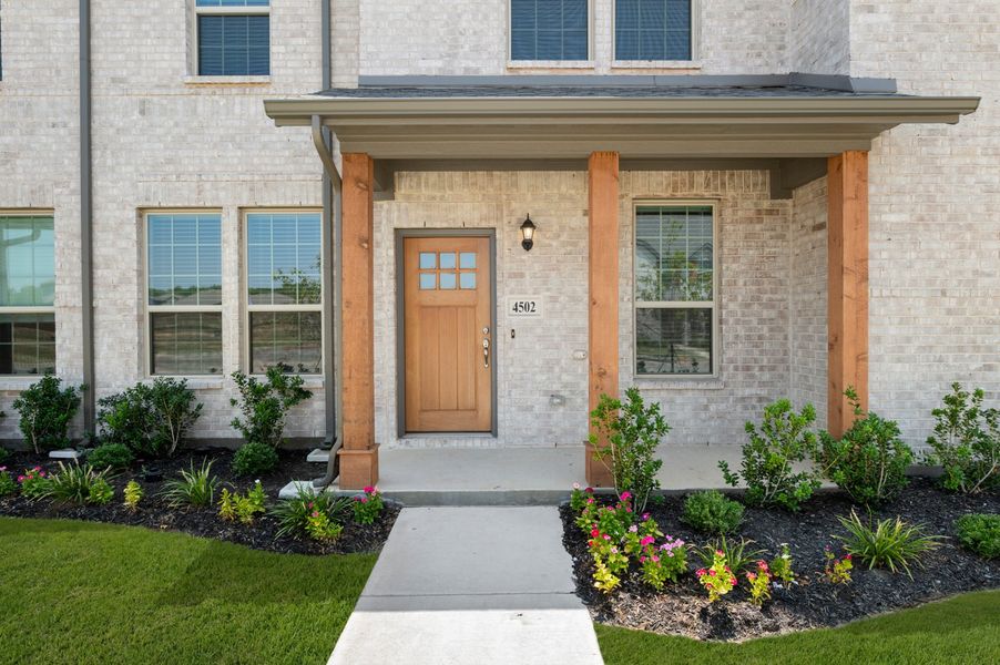 Front exterior of a new home in Sanger Circle – Townhomes, Sanger, TX, highlighting curb appeal (Image 29). Front exterior of a new home in Sanger Circle – Townhomes, Sanger, TX, highlighting curb appeal (Image 29).