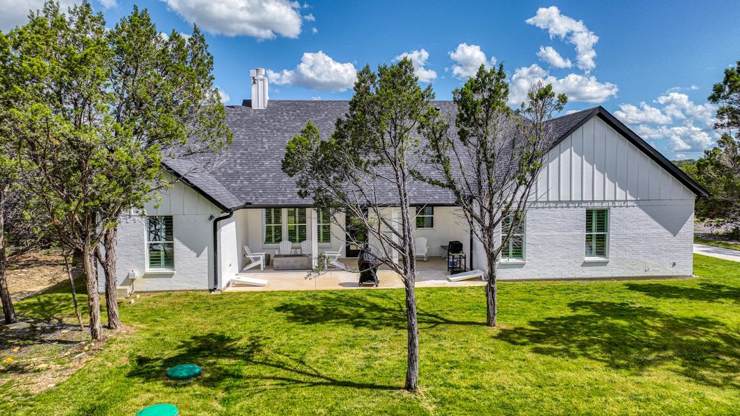 Representative exterior photo of a completed home built from the Lakeshore by Zeal Home Builders in Oak Water Ranch, Granbury, TX (Image 15). Representative exterior photo of a completed home built from the Lakeshore by Zeal Home Builders in Oak Water Ranch, Granbury, TX (Image 15).