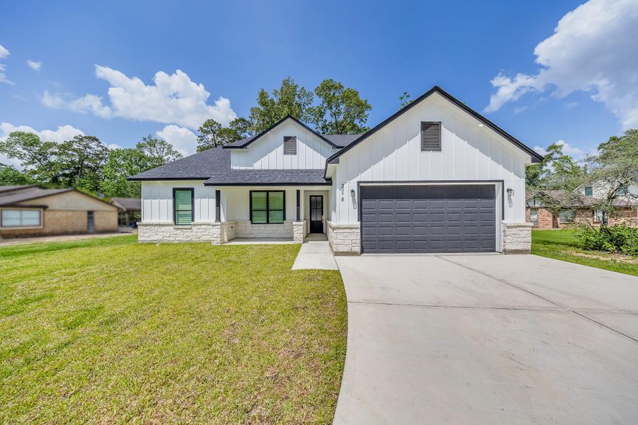 Front exterior of a new home in , New Caney, TX, highlighting curb appeal (Image 26).