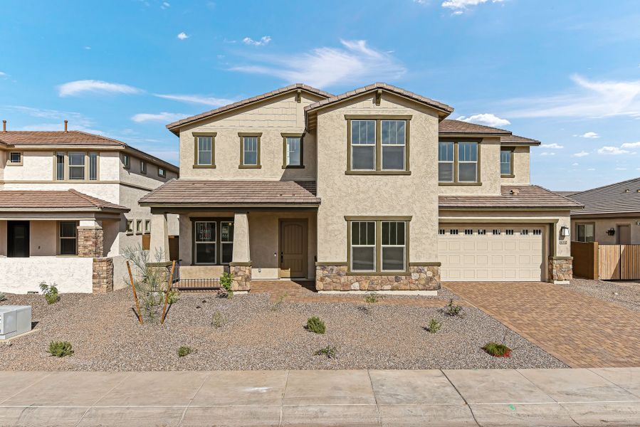 Front exterior of a new home in Stonehaven, Glendale, AZ, highlighting curb appeal (Image 1). Front exterior of a new home in Stonehaven, Glendale, AZ, highlighting curb appeal (Image 1).