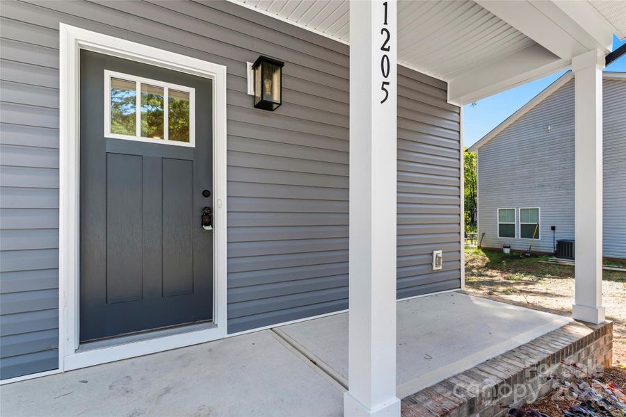 Front exterior of a new home in , Gastonia, NC, highlighting curb appeal (Image 13).