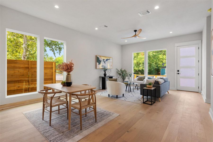 Dining space with recessed lighting, light wood finished floors, and ceiling fan Dining space with recessed lighting, light wood finished floors, and ceiling fan