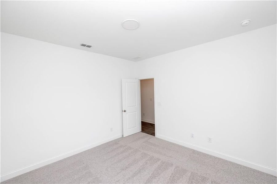 Another view of the secondary bedroom - Pictures represent a previously built home, not the actual home.