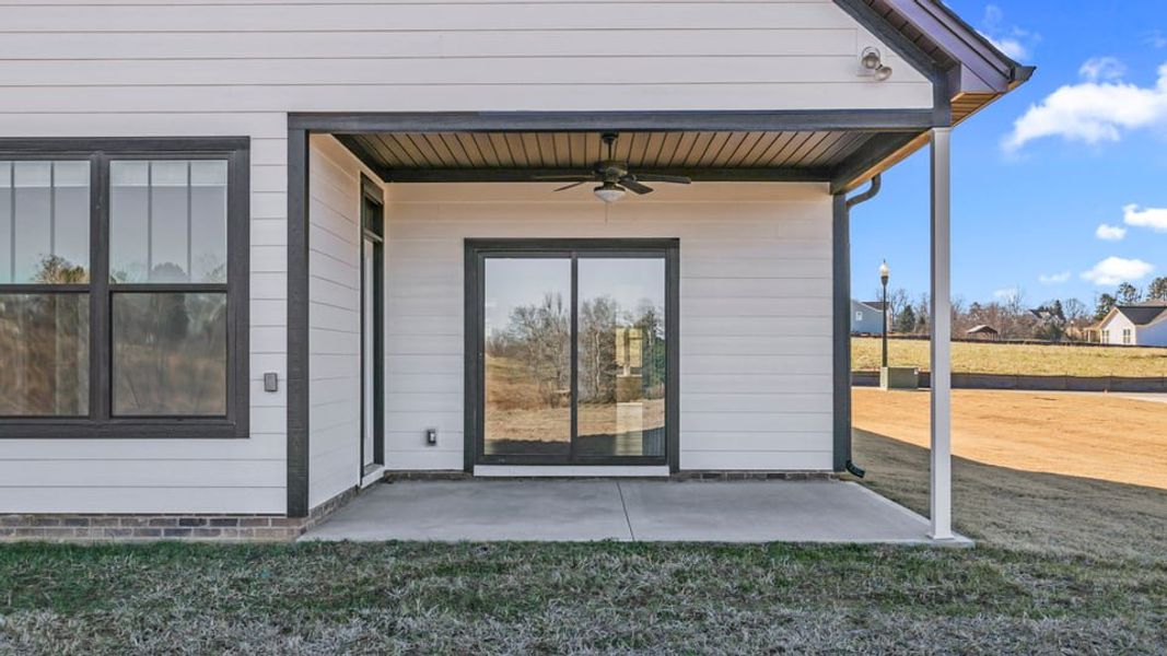 Exterior details and patio area of a home in Alder Pond, Campobello (Image 4).
