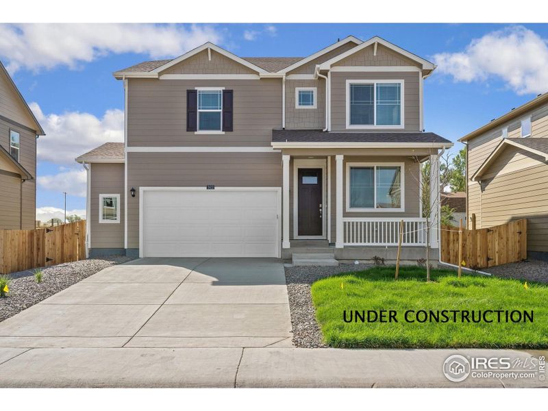 Front exterior of a new home in Brighton Crossing, Brighton, CO, highlighting curb appeal (Image 2).