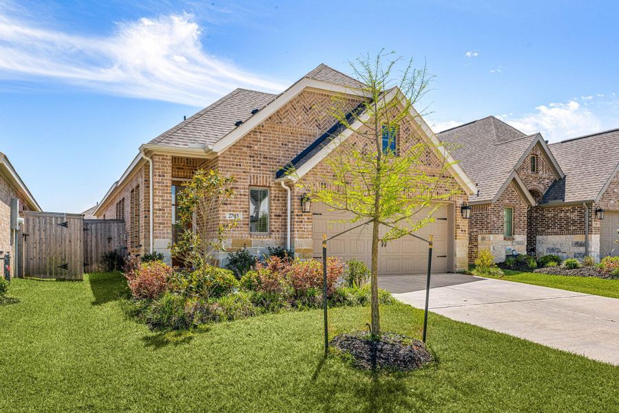Front exterior of a new home in The Grand Prairie, Hockley, TX, highlighting curb appeal (Image 19).