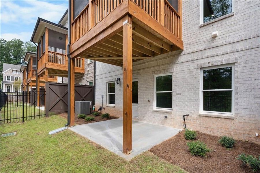 View of patio with a wooden deck View of patio with a wooden deck