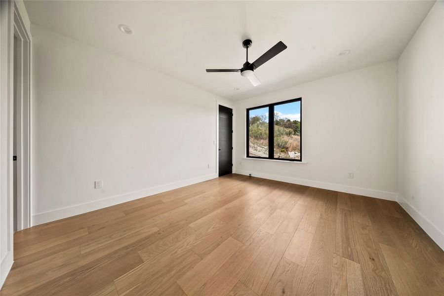 Spare room with light wood-type flooring and ceiling fan Spare room with light wood-type flooring and ceiling fan